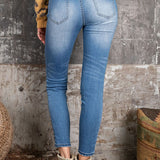 SKINNY FIT DISTRESSED SIDE TAPE JEANS